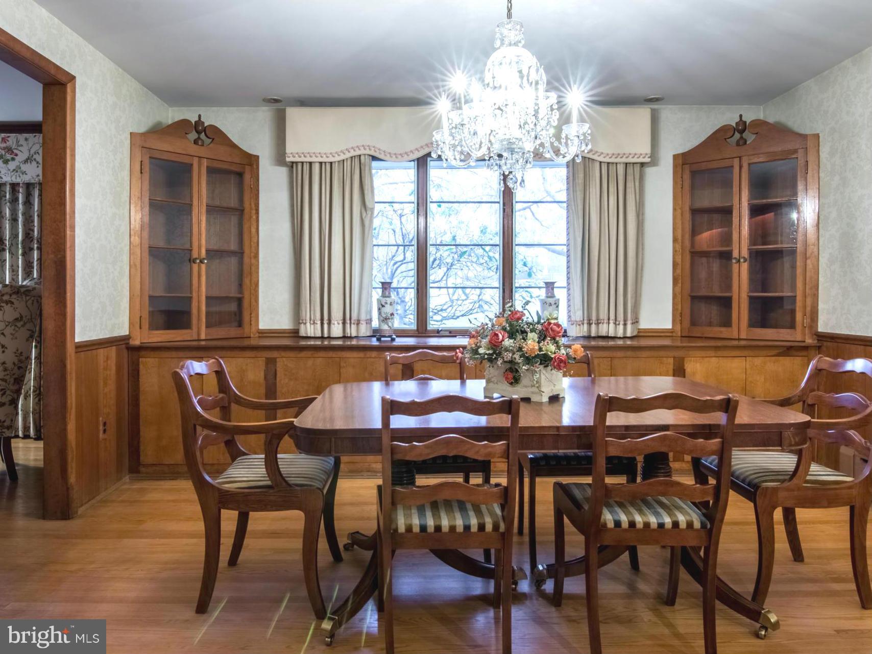801 Huntsman Road Baltimore, MD 21286 - Photo 7 of 22 a view of a dining room with furniture and chandelier