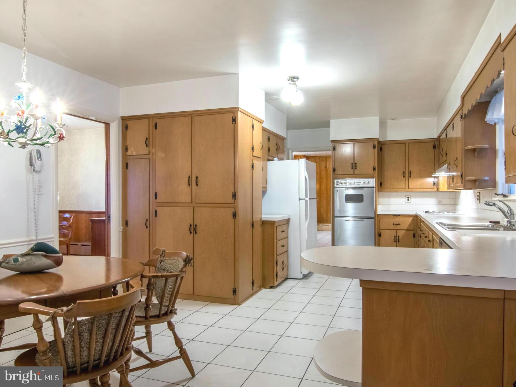 801 Huntsman Road Baltimore, MD 21286 - Photo 8 of 22 a kitchen with refrigerator and cabinets