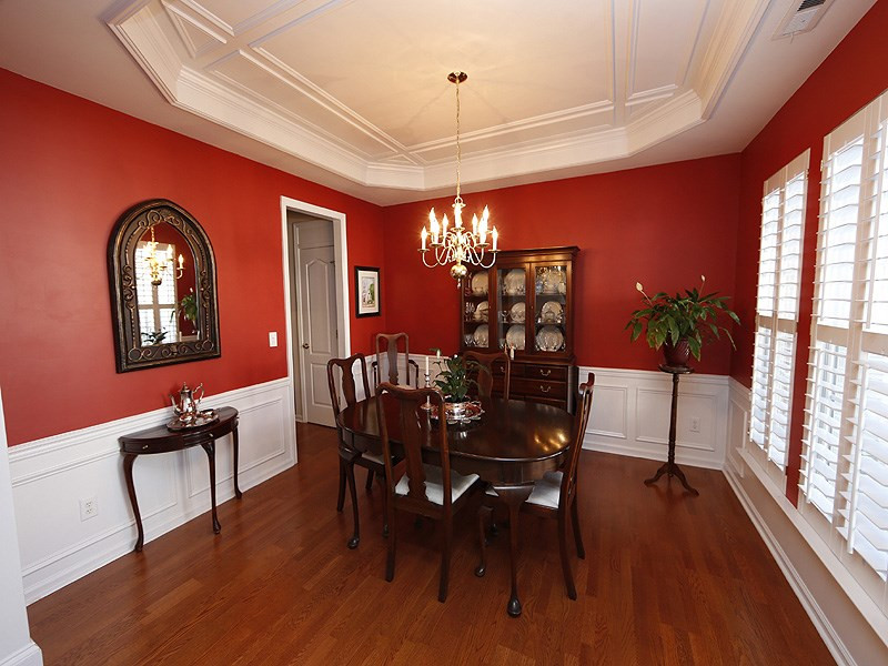 Separate Dining Room with trey ceiling and plantation shutters Dining Room
