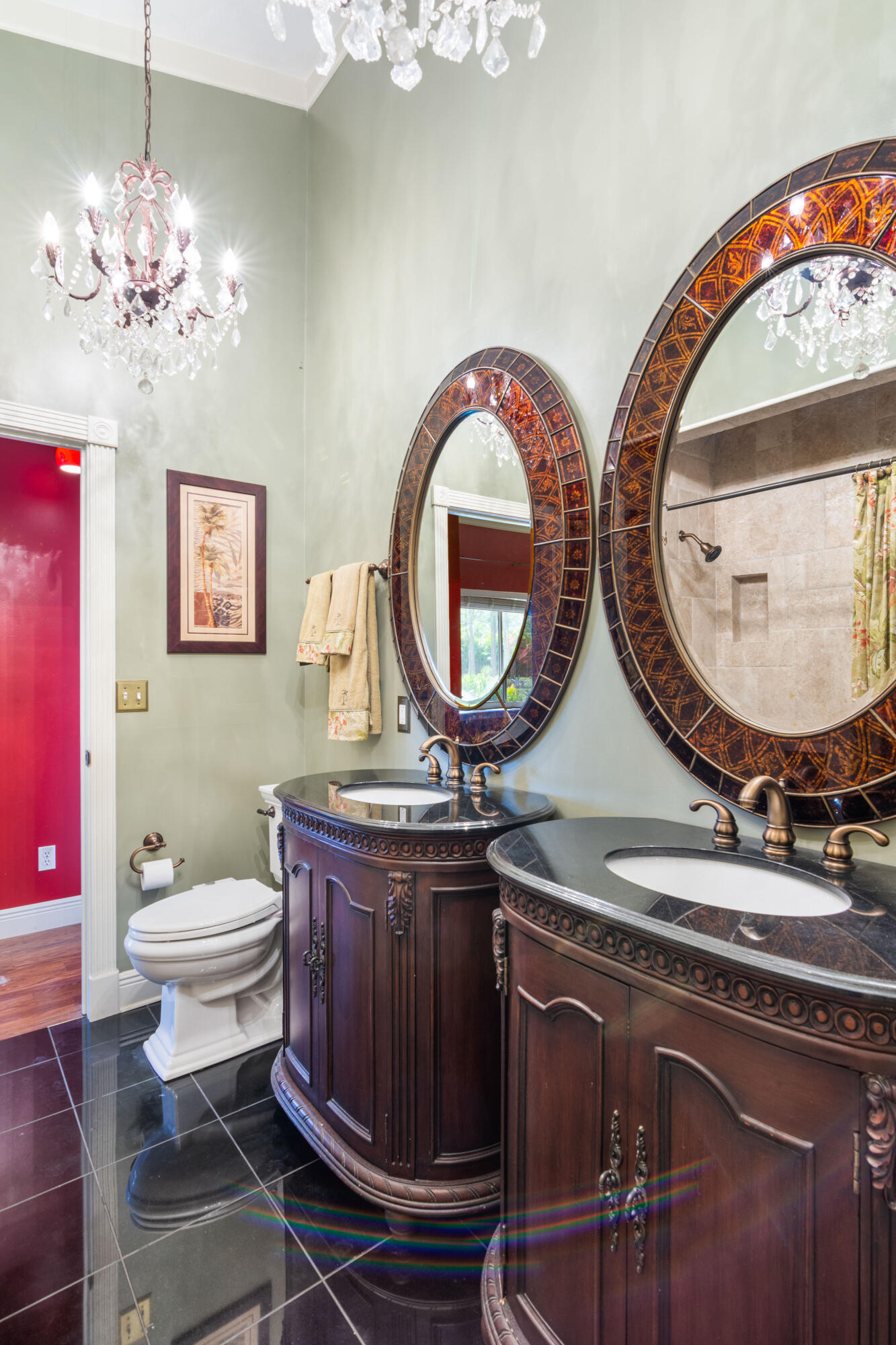 8850 Hidden Pines Road Fort Pierce, FL 34945 - Photo 18 of 72 a bathroom with a toilet a sink and a mirror