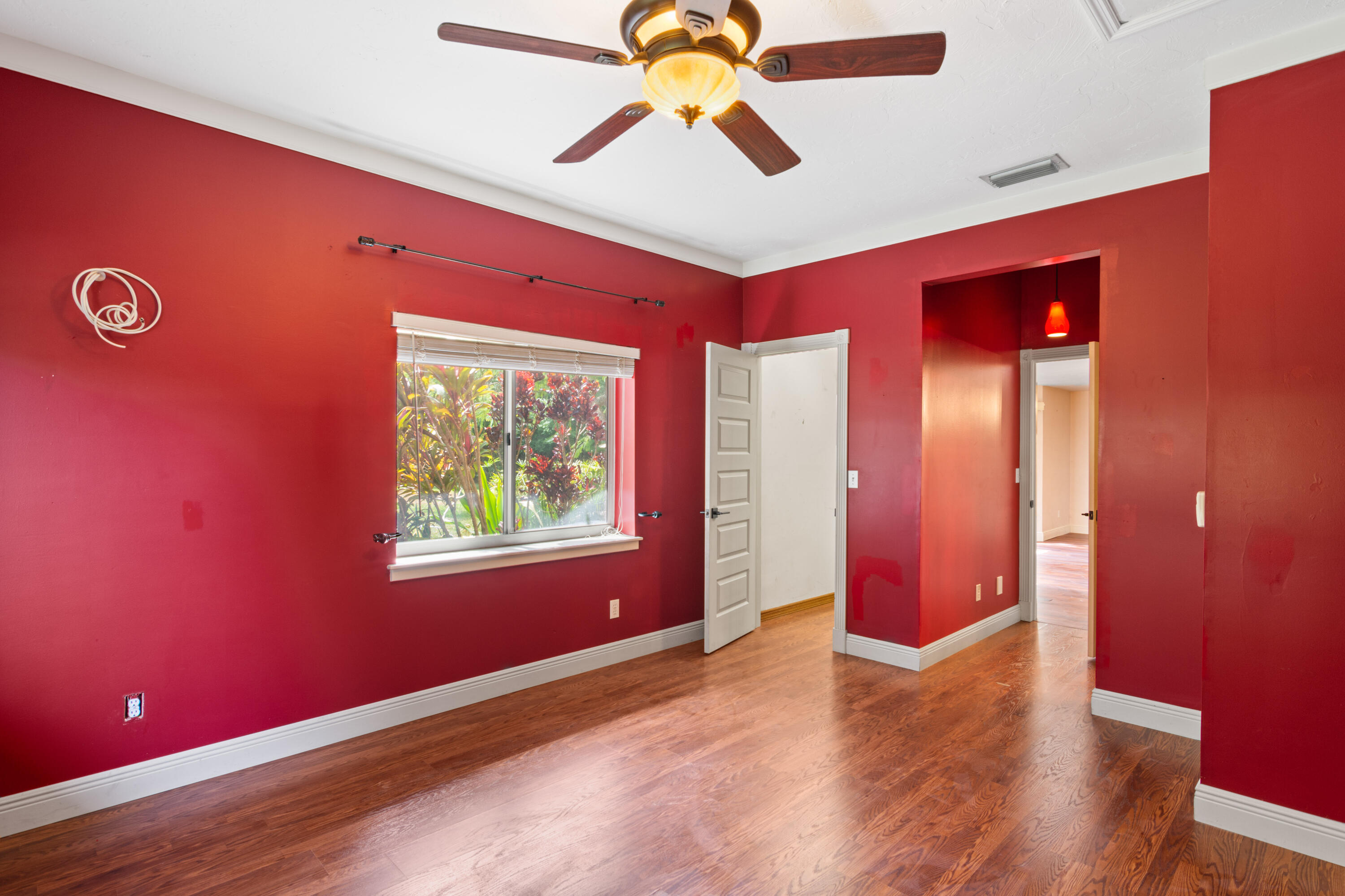 8850 Hidden Pines Road Fort Pierce, FL 34945 - Photo 20 of 72 a view of an empty room with window and a ceiling fan