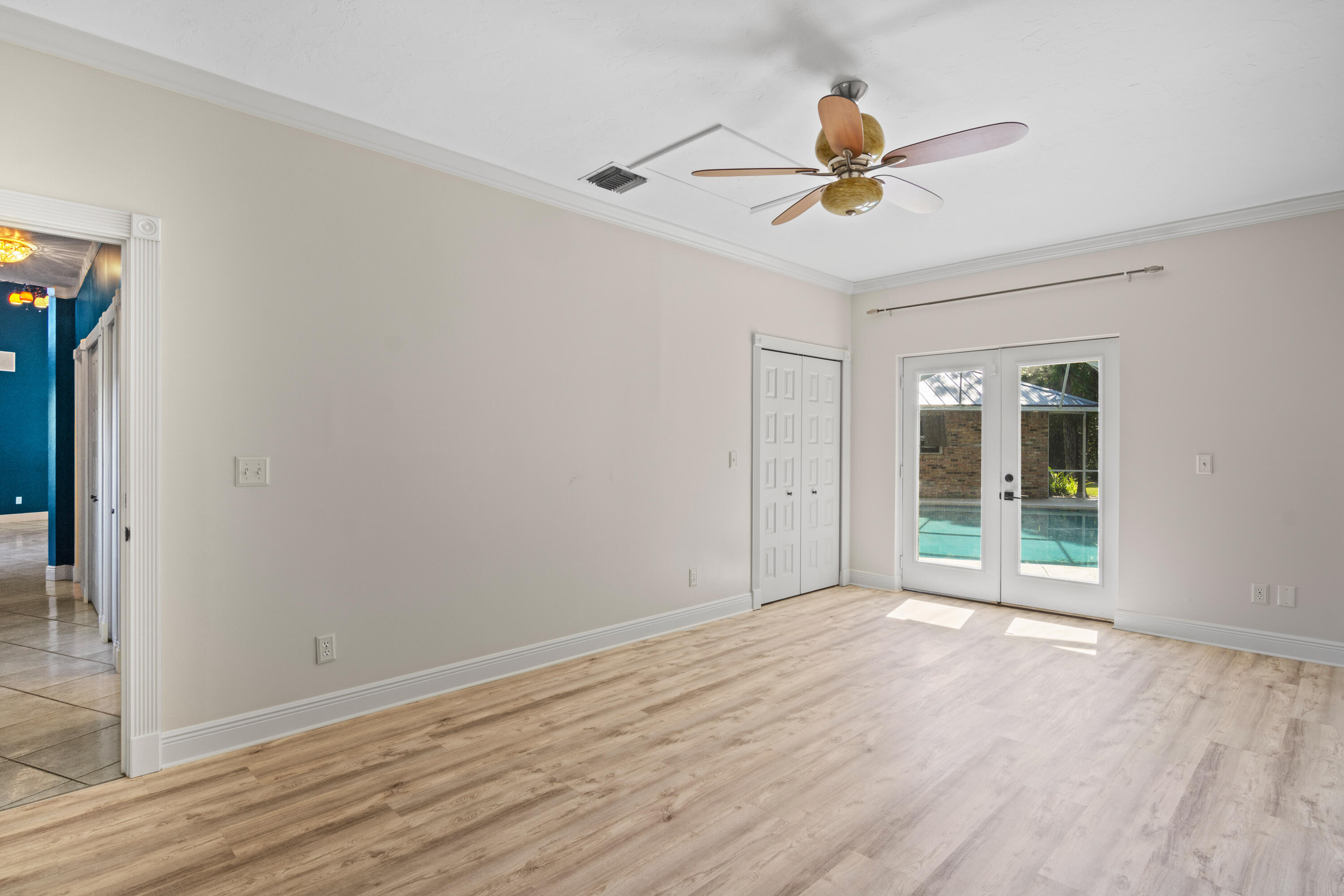 8850 Hidden Pines Road Fort Pierce, FL 34945 - Photo 35 of 72 a view of a ceiling fan and wooden floor