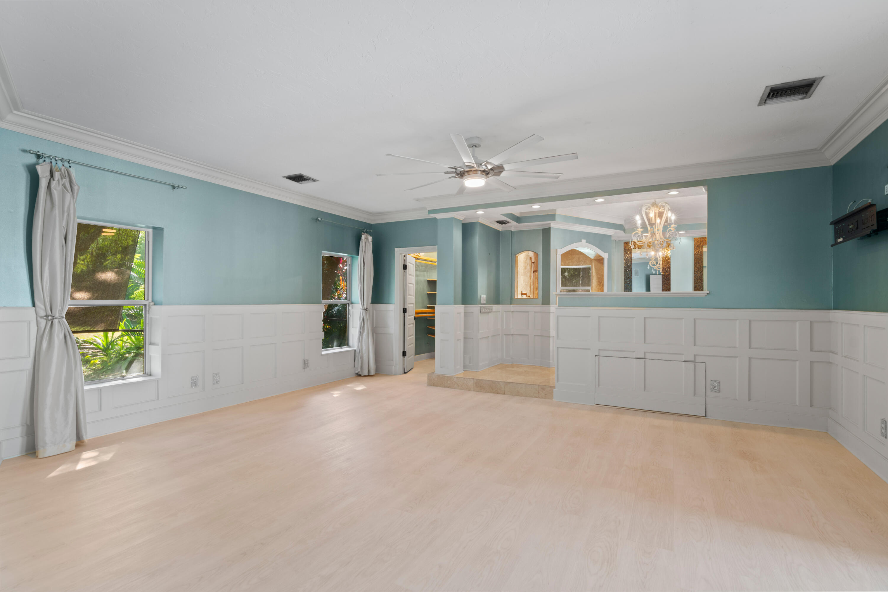 8850 Hidden Pines Road Fort Pierce, FL 34945 - Photo 36 of 72 a view of an empty room with a window and fireplace