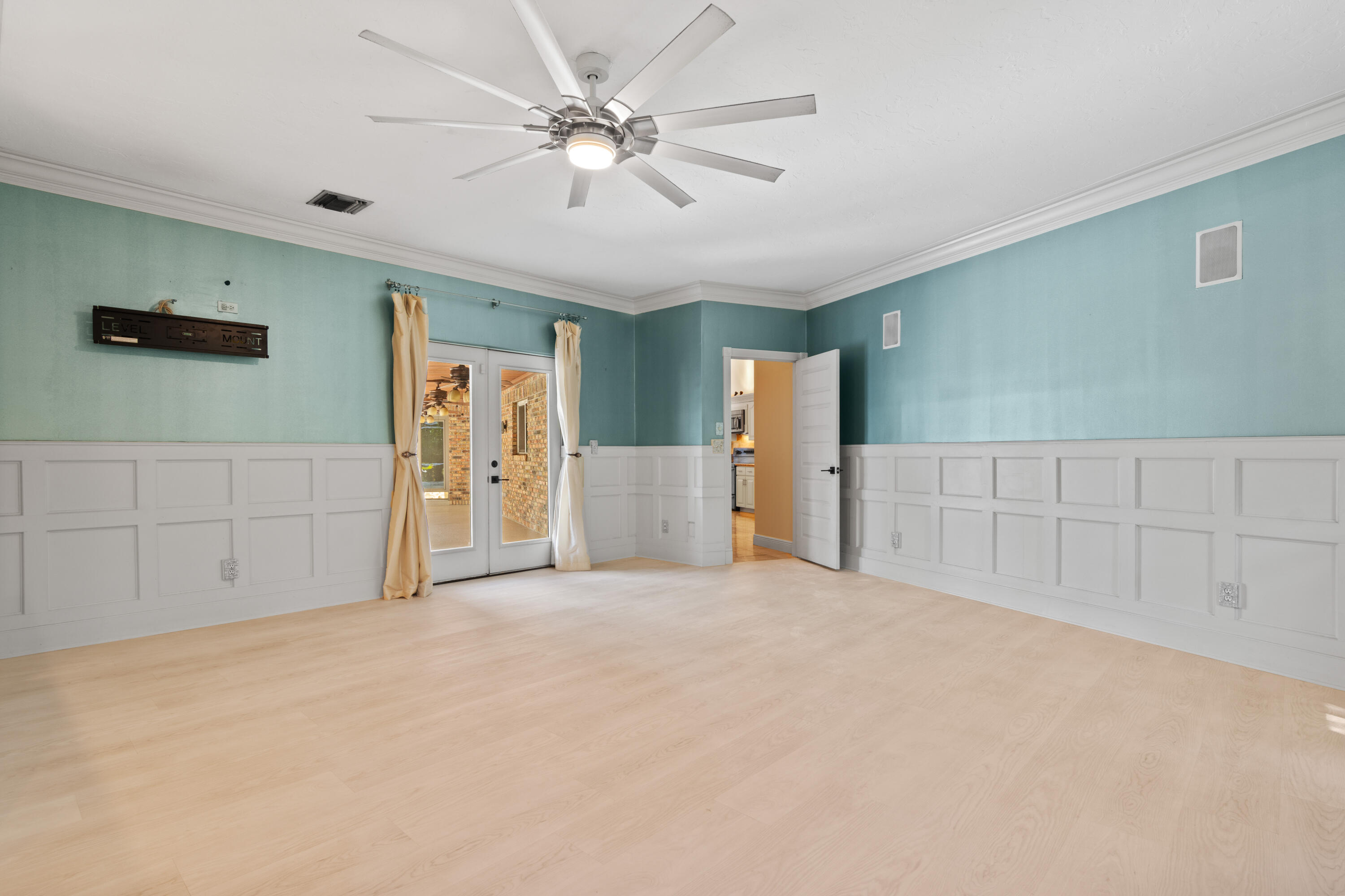 8850 Hidden Pines Road Fort Pierce, FL 34945 - Photo 38 of 72 a view of an empty room with chandelier fan