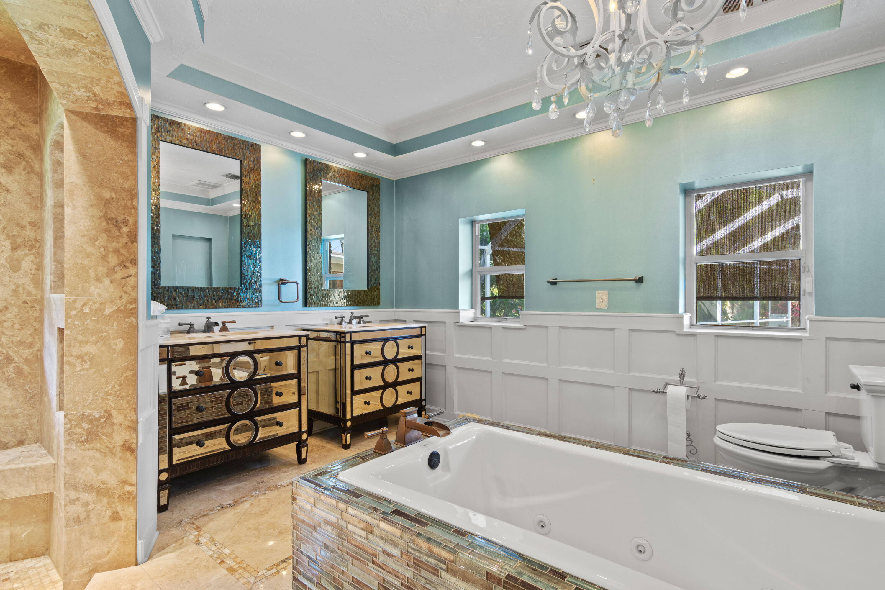 8850 Hidden Pines Road Fort Pierce, FL 34945 - Photo 39 of 72 a bathroom with a tub sink and mirror