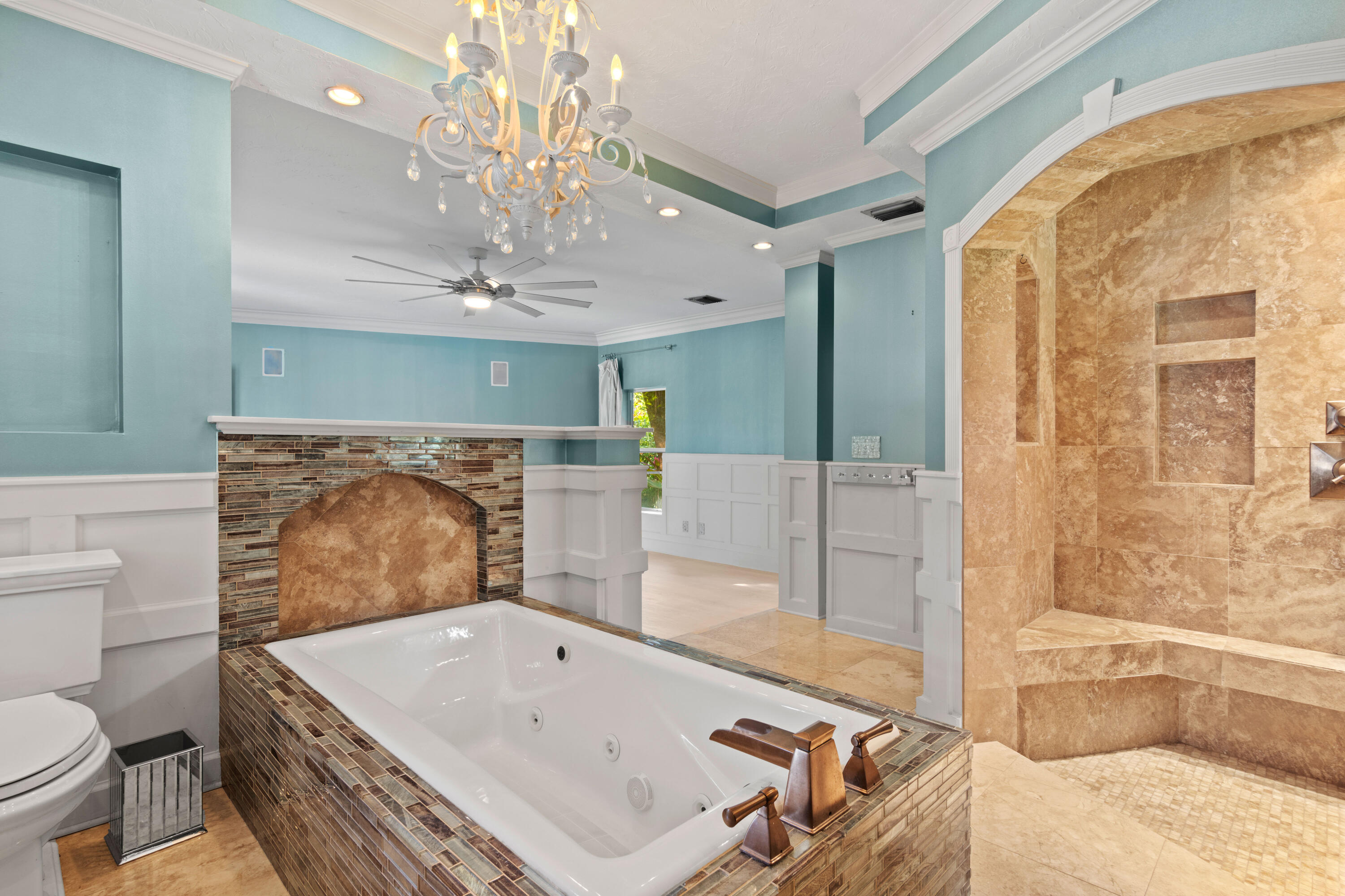 8850 Hidden Pines Road Fort Pierce, FL 34945 - Photo 41 of 72 a bathroom with a tub a toilet and a shower