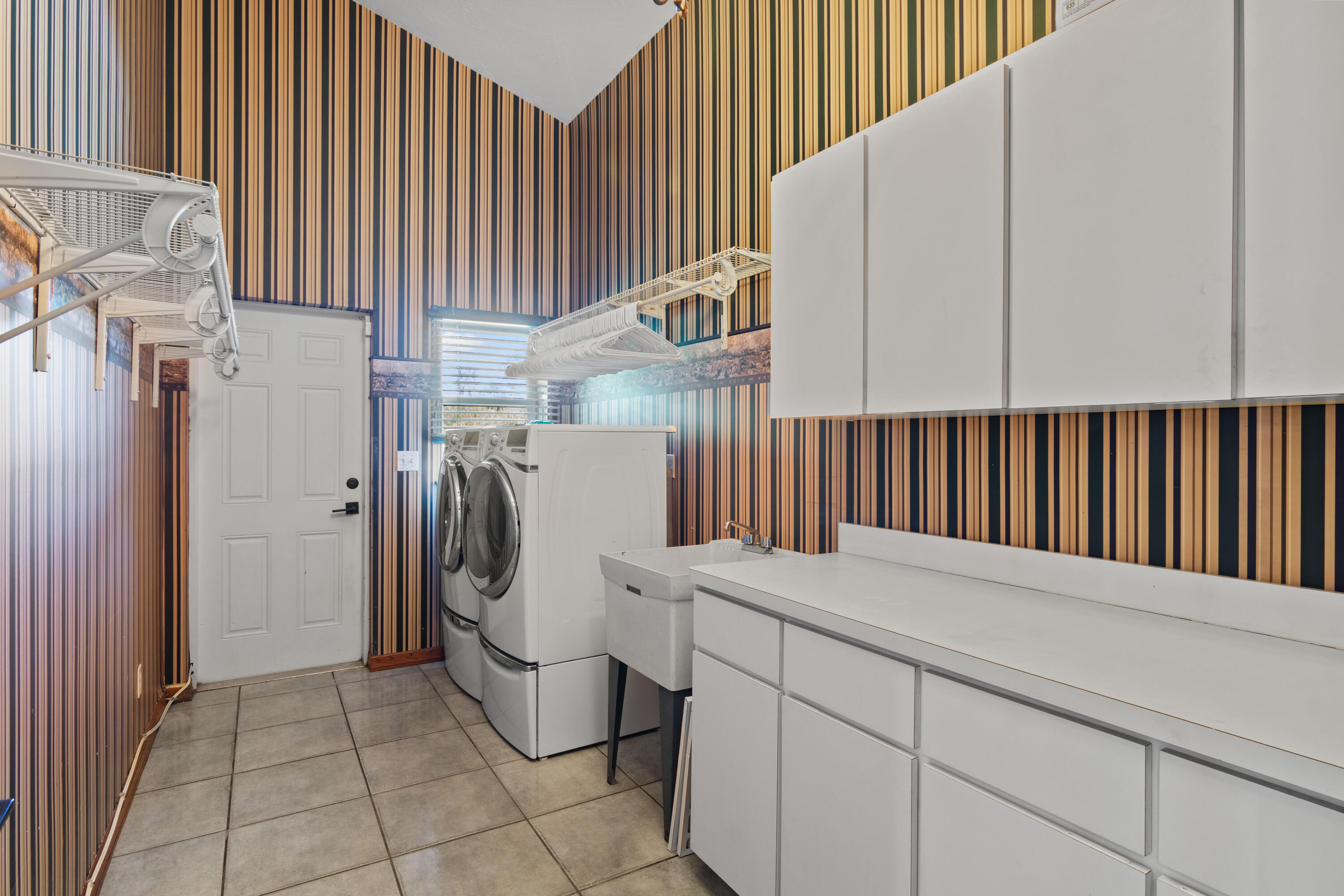 8850 Hidden Pines Road Fort Pierce, FL 34945 - Photo 43 of 72 a utility room with dryer and washer