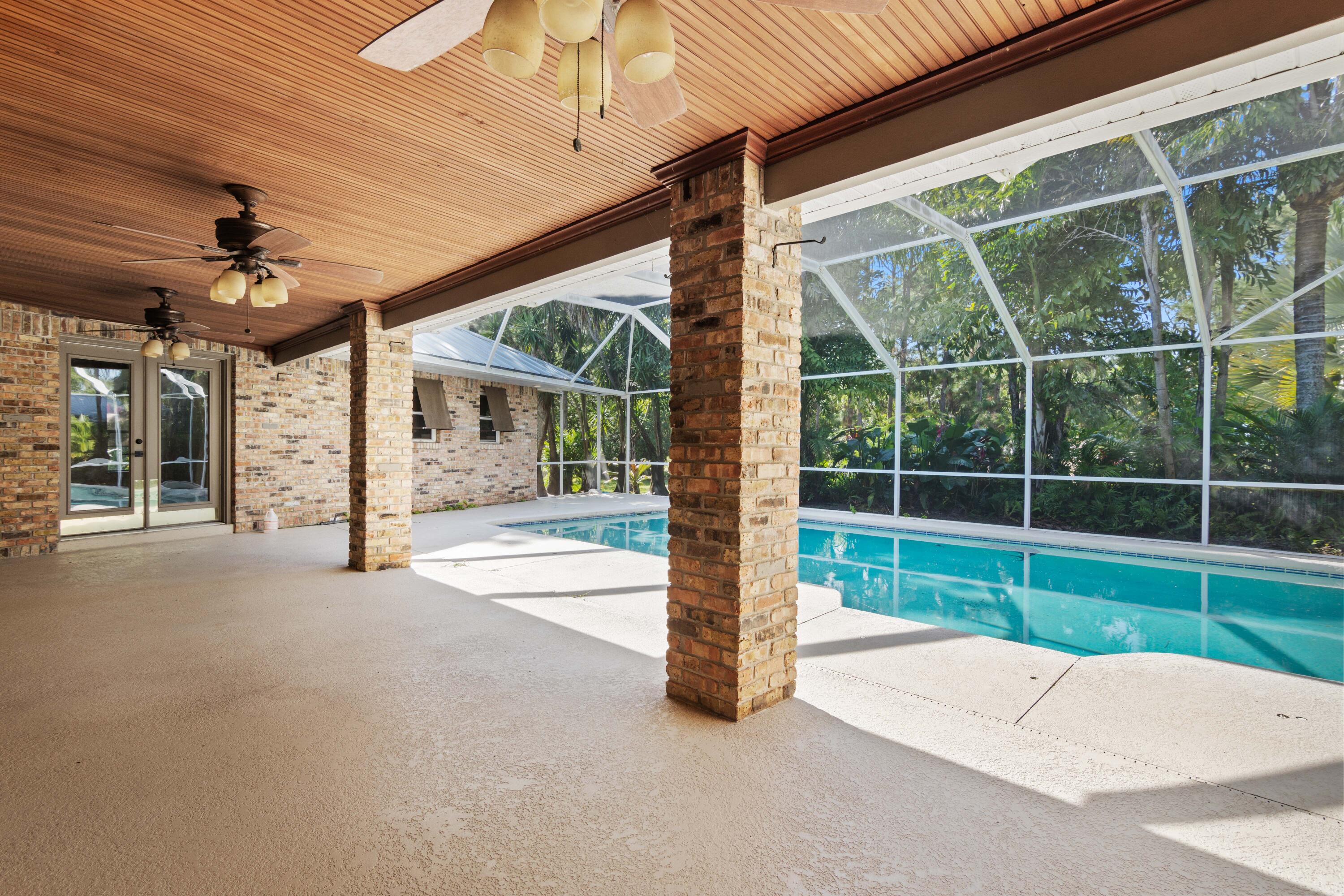 8850 Hidden Pines Road Fort Pierce, FL 34945 - Photo 45 of 72 a view of a house with a outdoor space