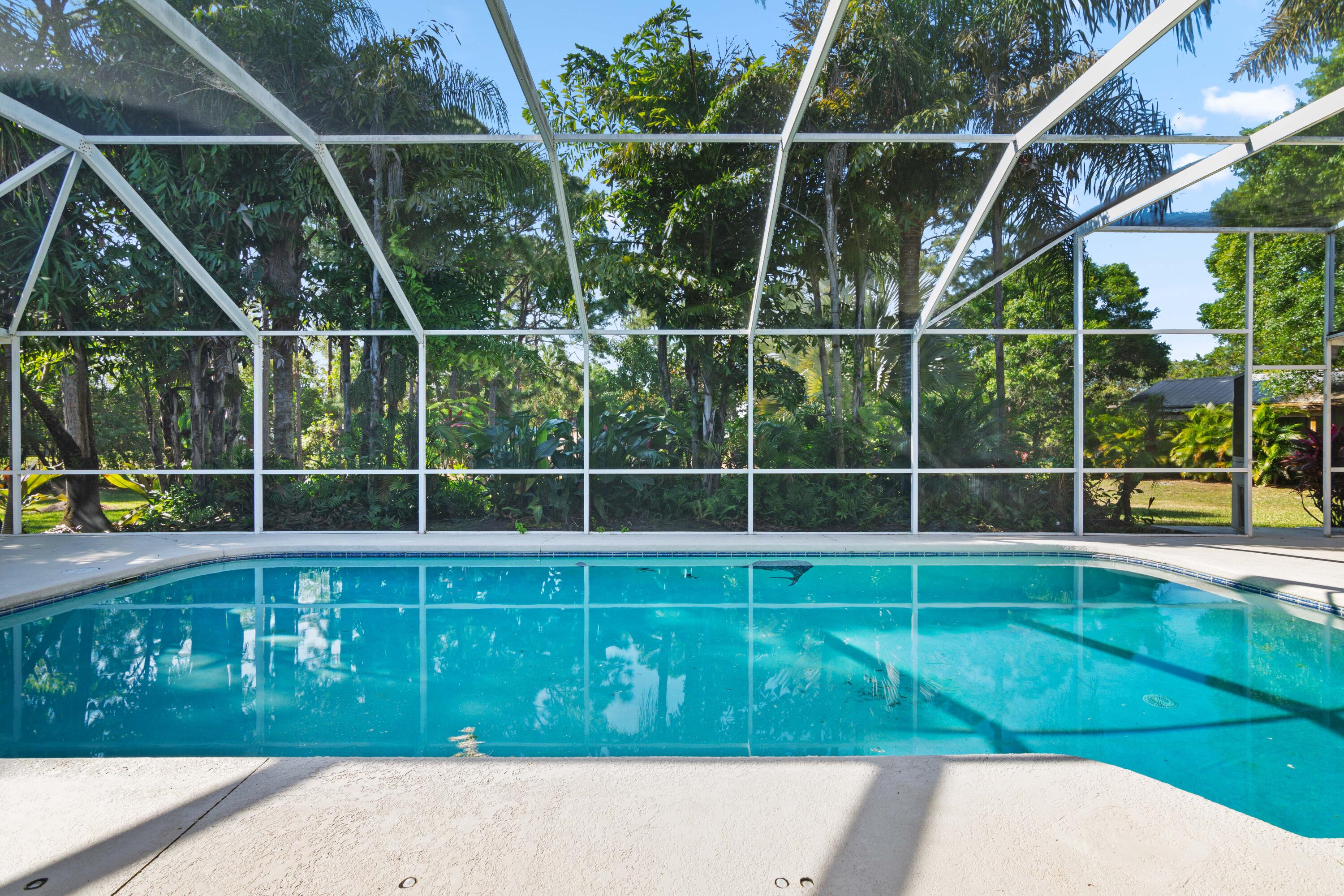 8850 Hidden Pines Road Fort Pierce, FL 34945 - Photo 46 of 72 a view of a backyard
