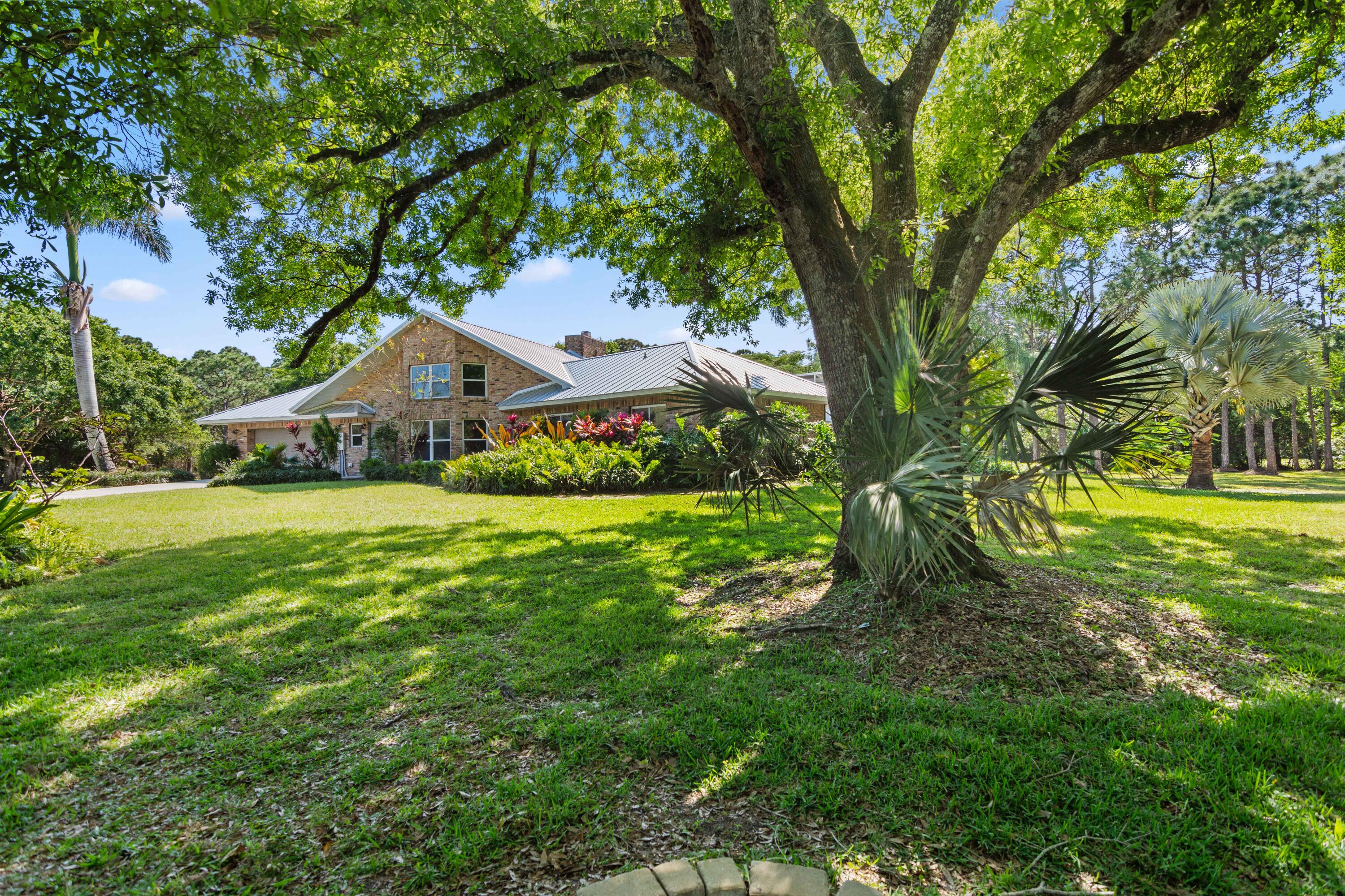 8850 Hidden Pines Road Fort Pierce, FL 34945 - Photo 50 of 72 a view of house with garden