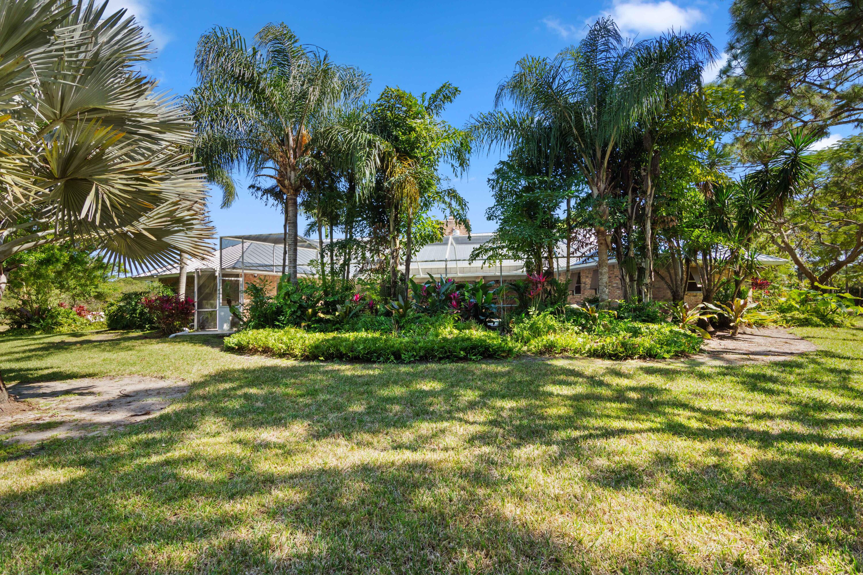 8850 Hidden Pines Road Fort Pierce, FL 34945 - Photo 57 of 72 a view of a house with a street