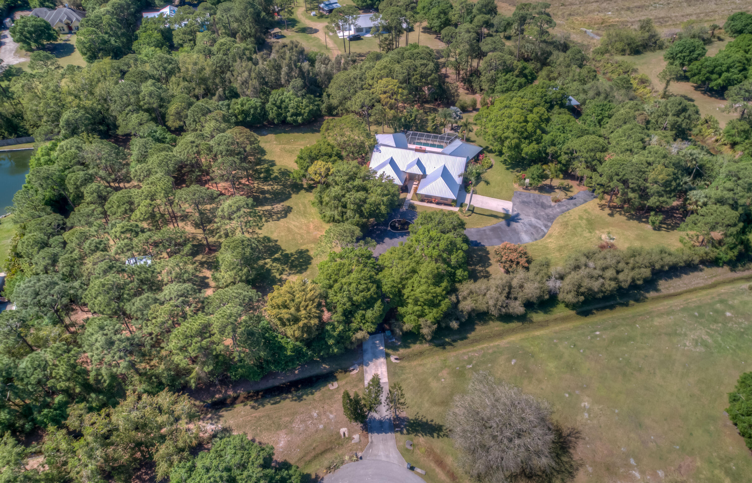 8850 Hidden Pines Road Fort Pierce, FL 34945 - Photo 65 of 72 an aerial view of a house with a yard