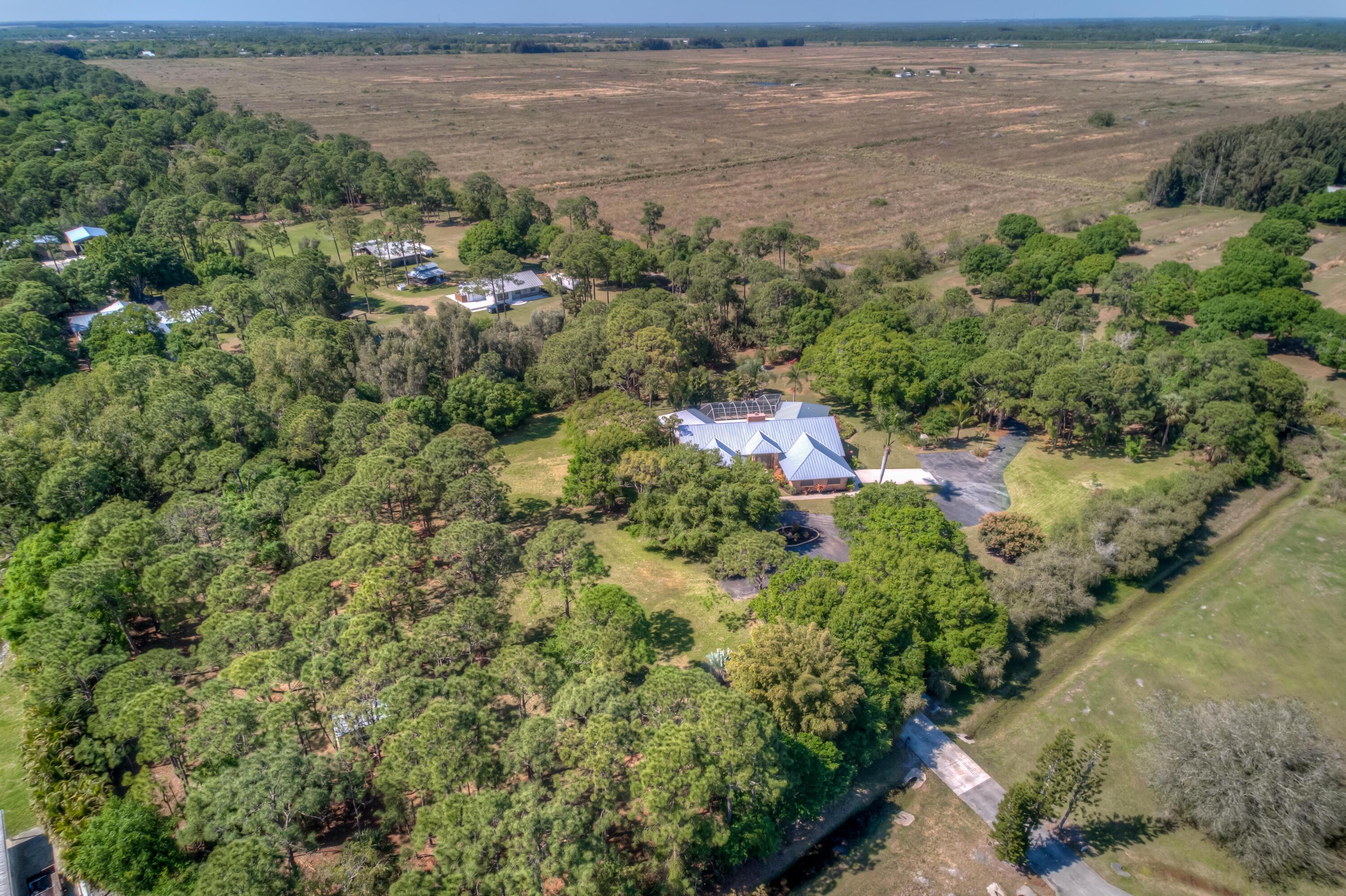 8850 Hidden Pines Road Fort Pierce, FL 34945 - Photo 66 of 72 a view of a lake with beach and outdoor space