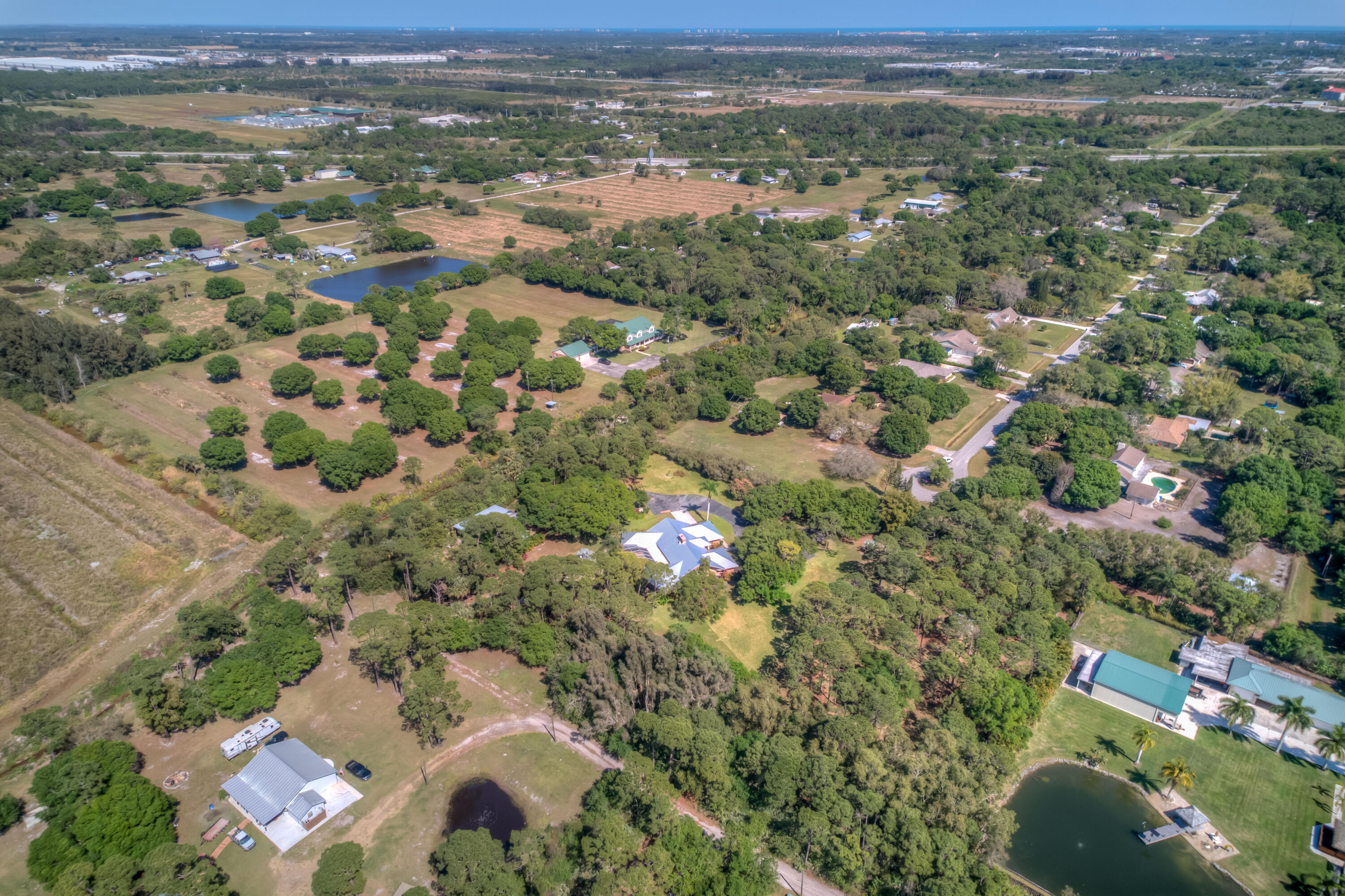8850 Hidden Pines Road Fort Pierce, FL 34945 - Photo 71 of 72 an aerial view of residential houses with outdoor space