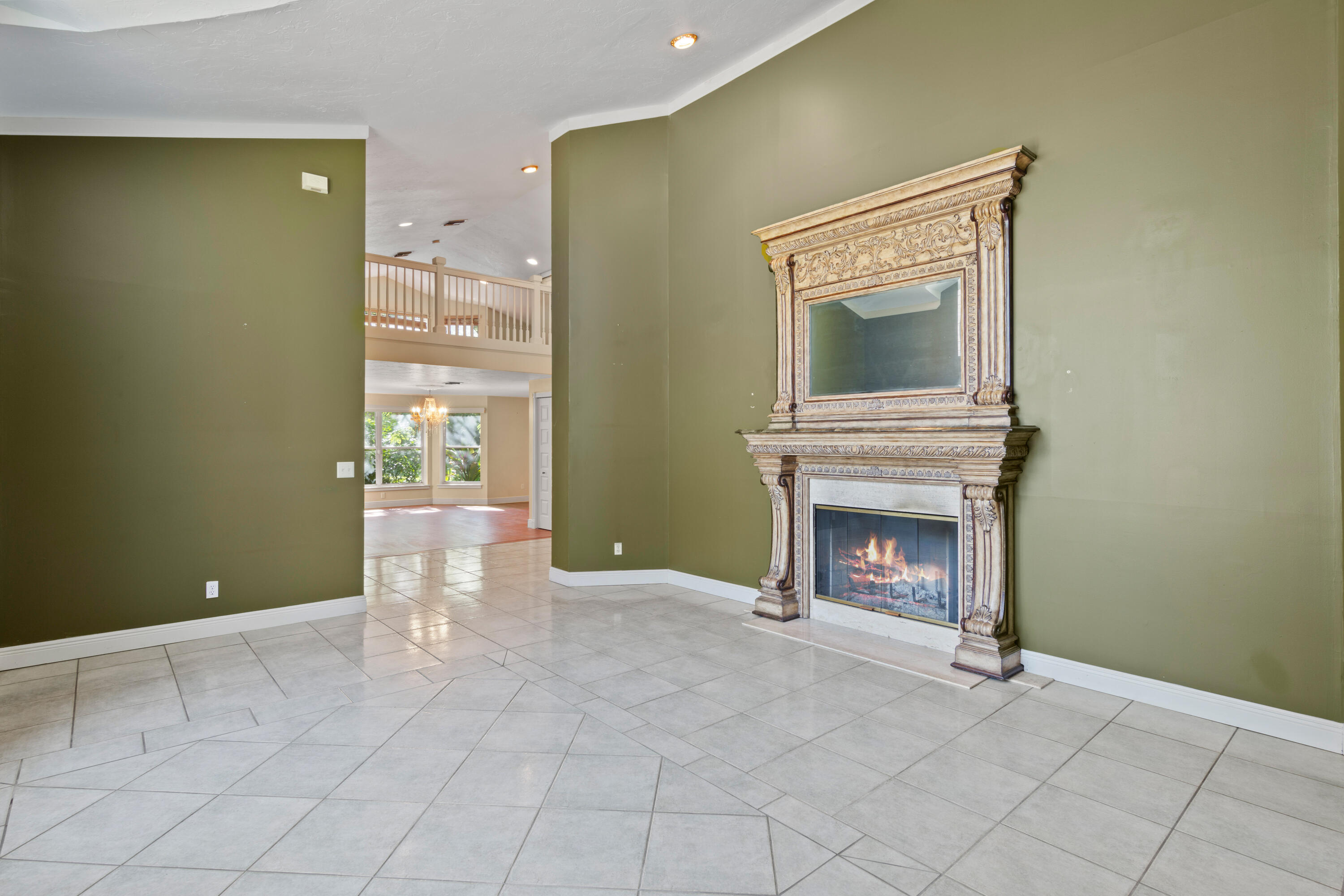 8850 Hidden Pines Road Fort Pierce, FL 34945 - Photo 9 of 72 a view of an empty room with fireplace and a window
