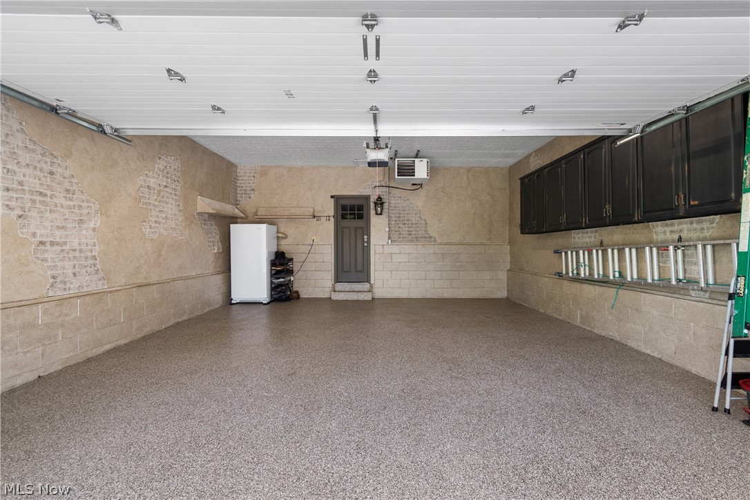 440 Moore Road Green, OH 44319 - Photo 34 of 43 heated garage with epoxy floor and decorative painted walls