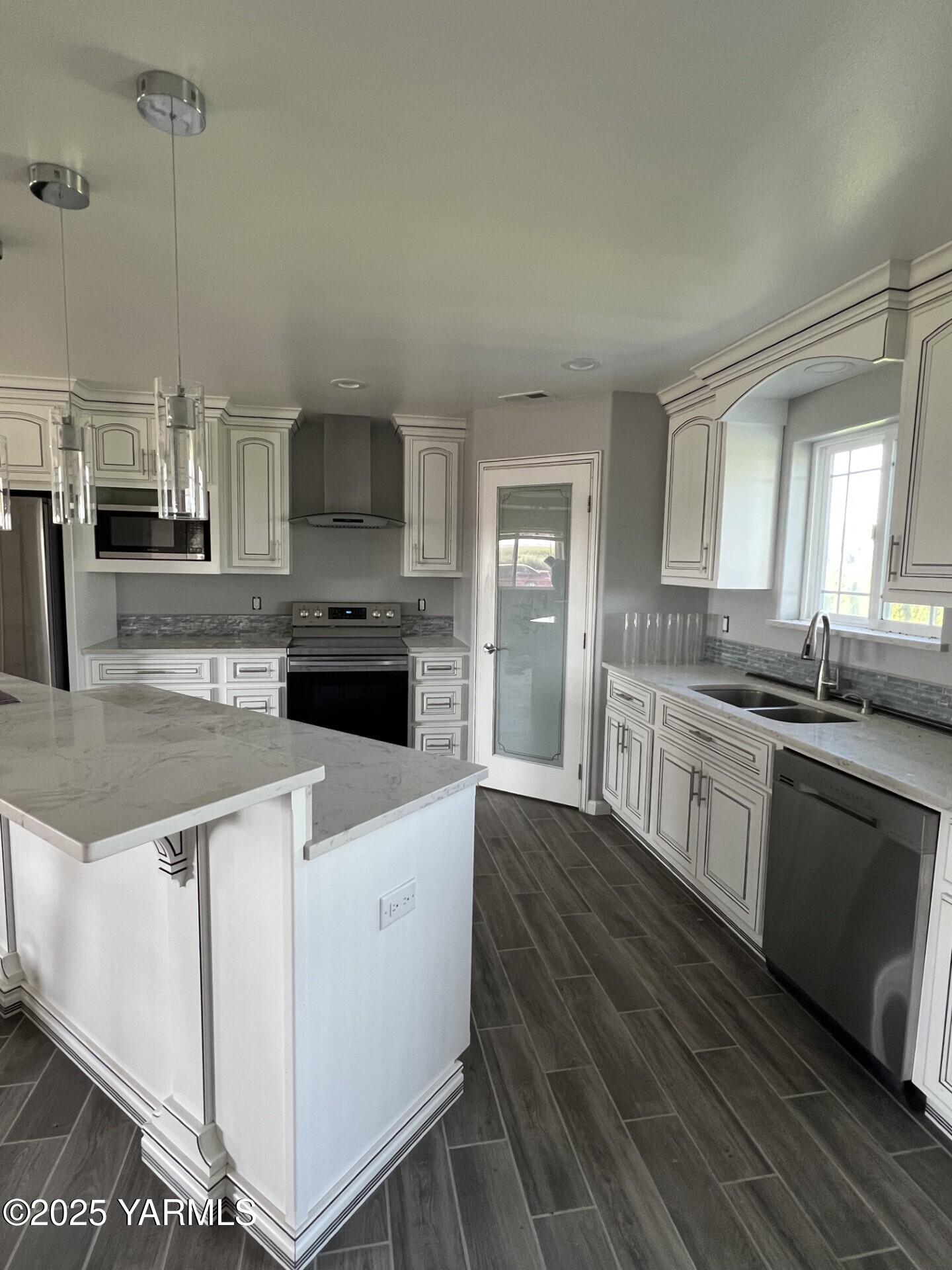 1108 2nd Avenue Granger, WA 98932 - Photo 3 of 13 a kitchen with stainless steel appliances granite countertop a stove and a sink