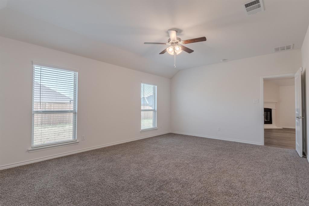 2902 Trusting Way Aubrey, TX 76227 - Photo 16 of 38 Spacious room featuring vaulted ceilings, recessed lighting, and soft grey carpet flooring