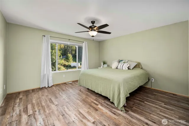 a bedroom with a bed and a window