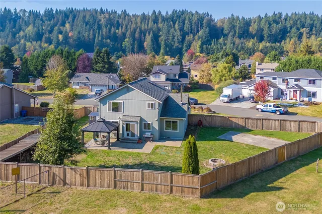 a view of a house with swimming pool yard and outdoor seating
