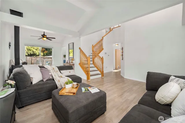 a living room with furniture and a potted plant