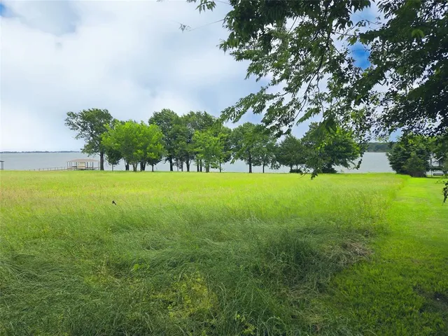 a view of yard with island in the background