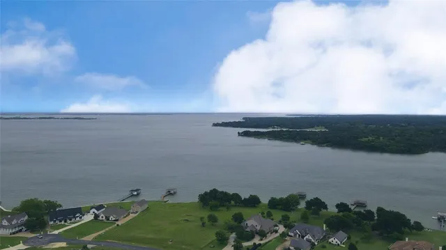 a view of a big yard with large trees