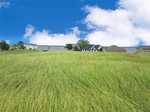 a view of a lake with a yard