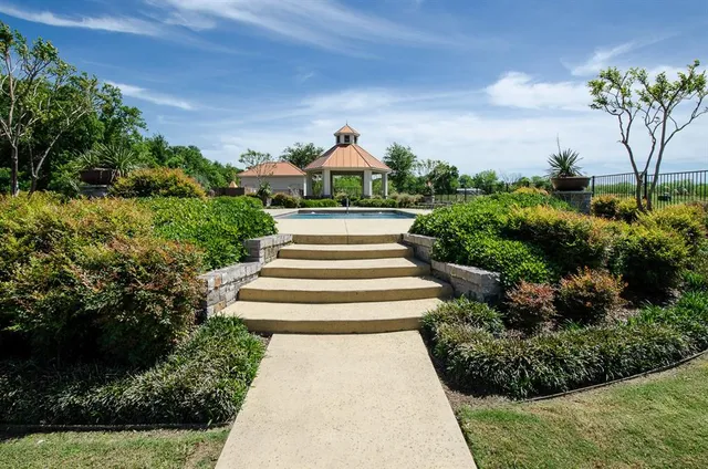 a view of a garden from a lake