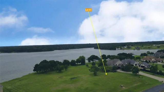 a view of grassy field with mountain