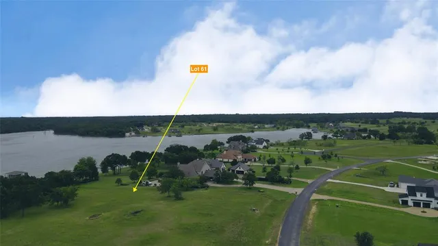 an aerial view of a golf course with chairs