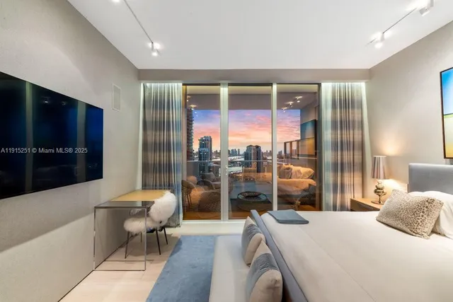 a room with furniture a flat screen tv and a view of living room