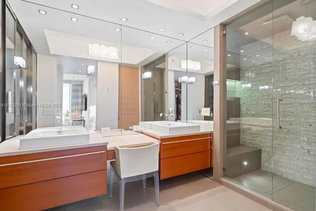 a room with a table chairs and mirrors