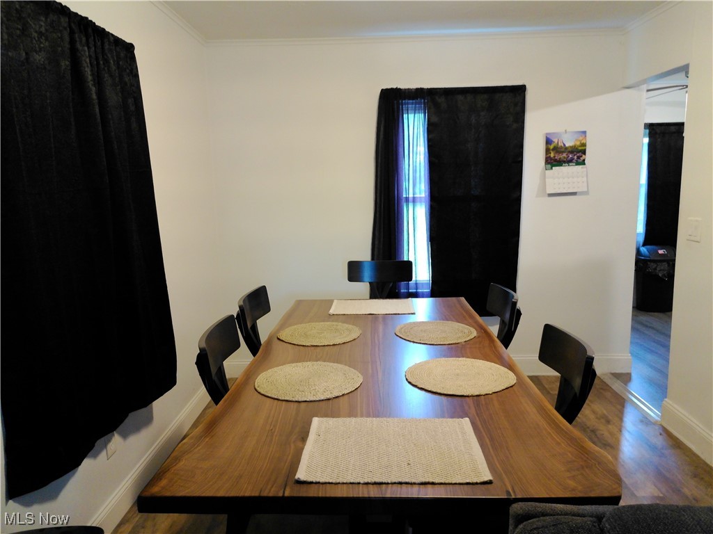 5476 Chippewa Road Medina, OH 44215 - Photo 13 of 30 Dining room featuring ornamental molding and wood finished floors