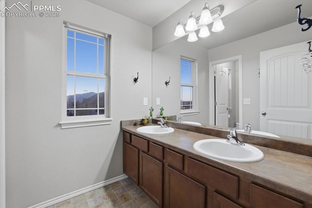 2374 Cinnabar Road Colorado Springs, CO 80921 - Photo 35 of 48 This second upper-level bath also has dual vanities and plenty of counter space.