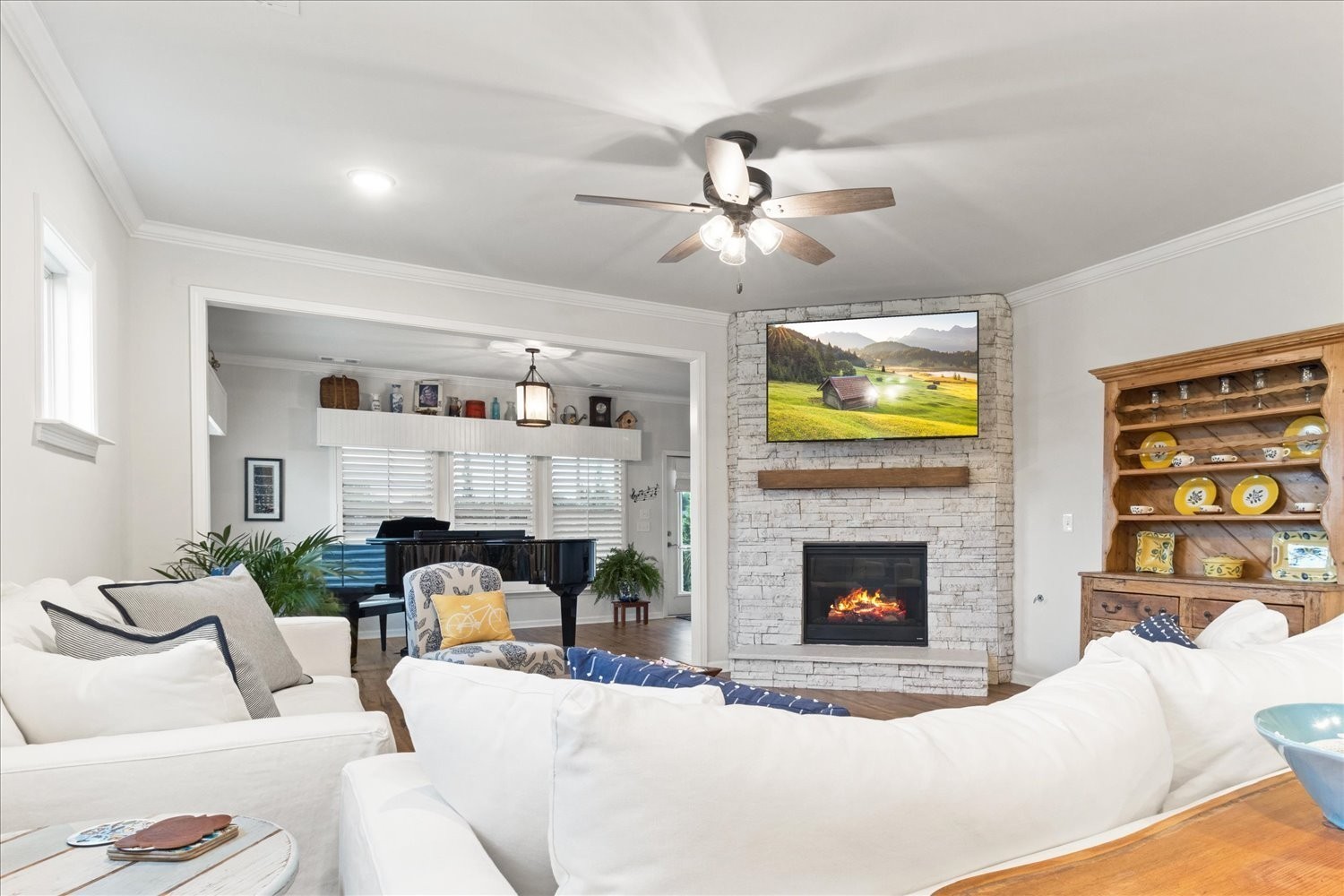 1055 Sumner Grove Spring Hill, TN 37174 - Photo 16 of 48 a living room with furniture a fireplace and a flat screen tv
