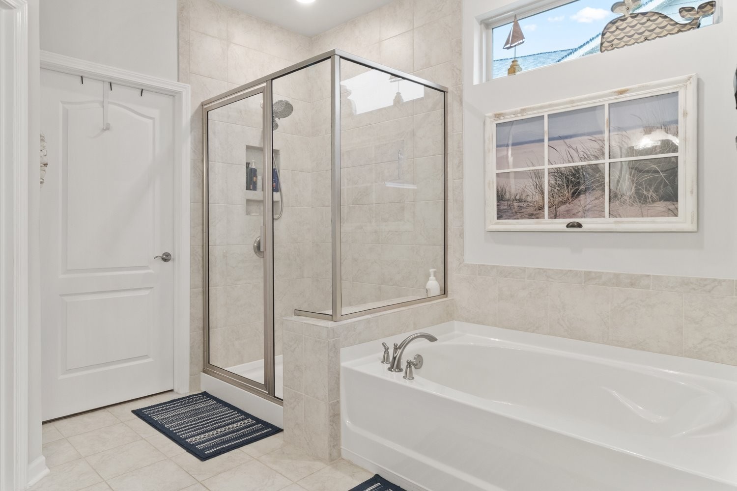 1055 Sumner Grove Spring Hill, TN 37174 - Photo 23 of 48 a bathroom with a bathtub and a shower
