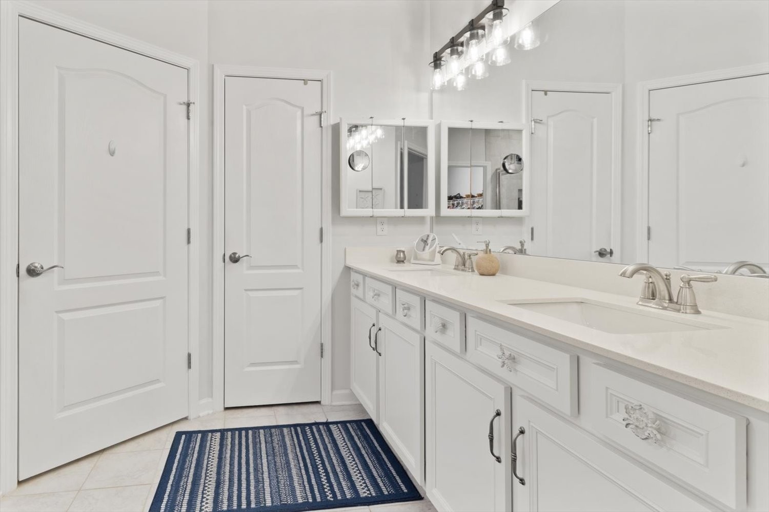 1055 Sumner Grove Spring Hill, TN 37174 - Photo 24 of 48 a spacious bathroom with a sink double vanity and a mirror