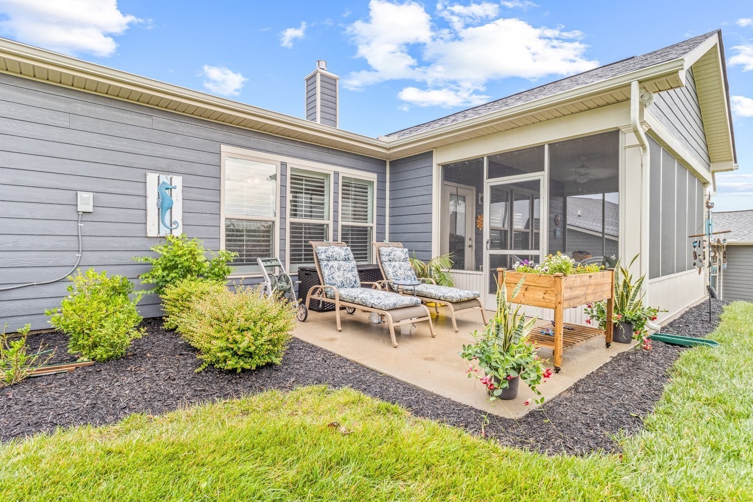 1055 Sumner Grove Spring Hill, TN 37174 - Photo 35 of 48 a view of a house with backyard sitting area and garden