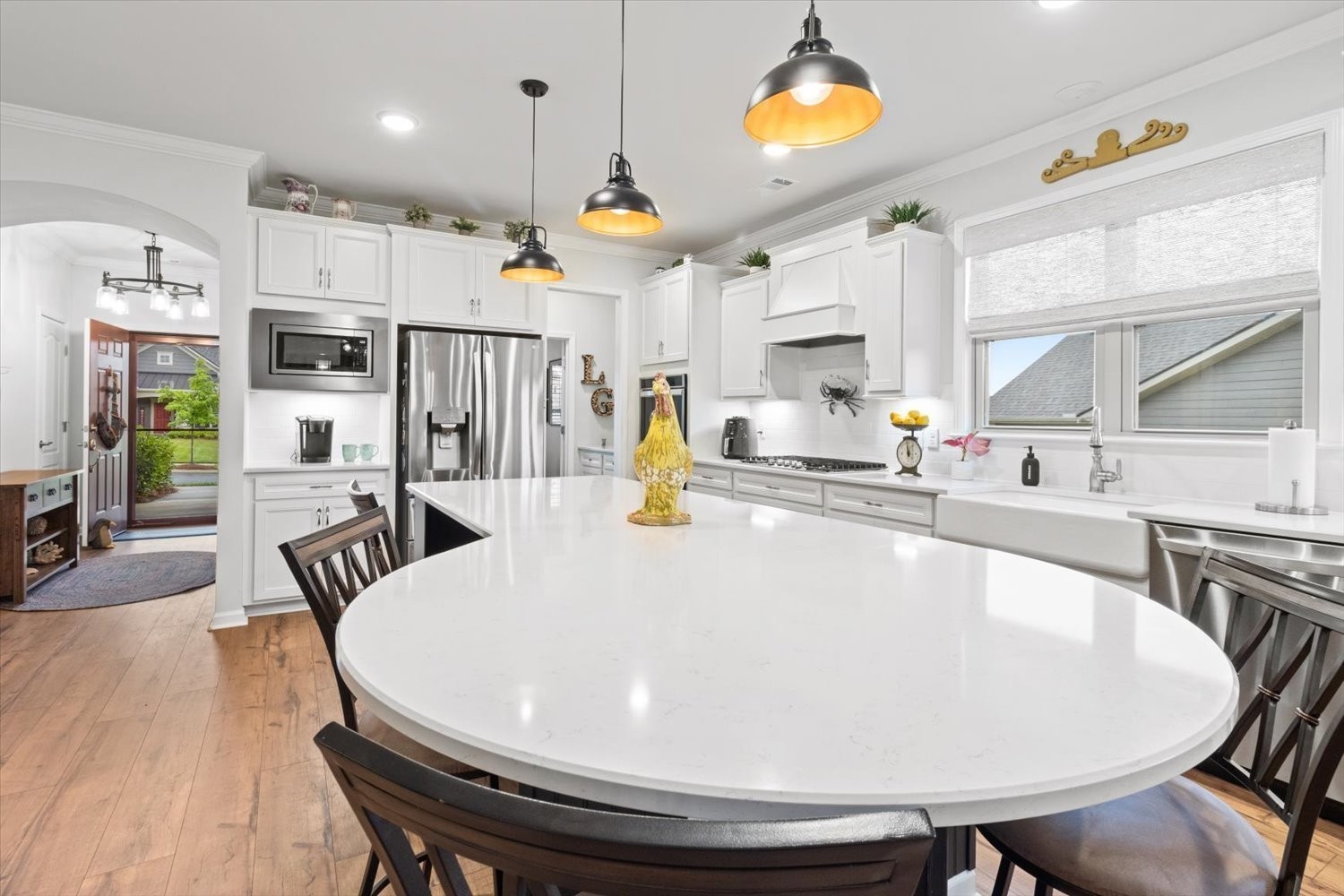1055 Sumner Grove Spring Hill, TN 37174 - Photo 10 of 48 a large white kitchen with a table and chairs