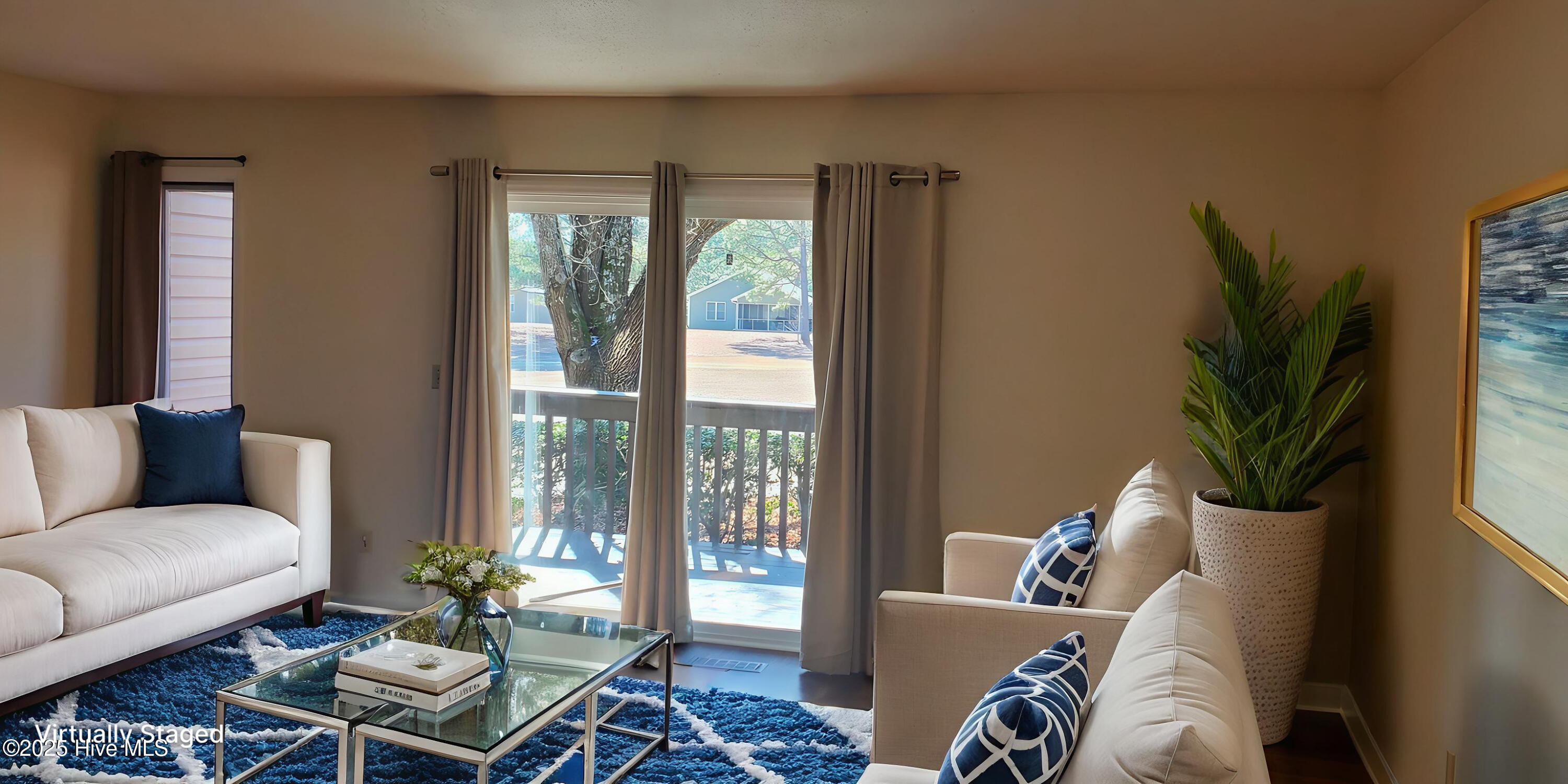 234 Persimmon Drive, Unit C Pinebluff, NC 28373 - Photo 6 of 22 The warm, natural tones of the room create a welcoming atmosphere, perfect for family gatherings and relaxation.