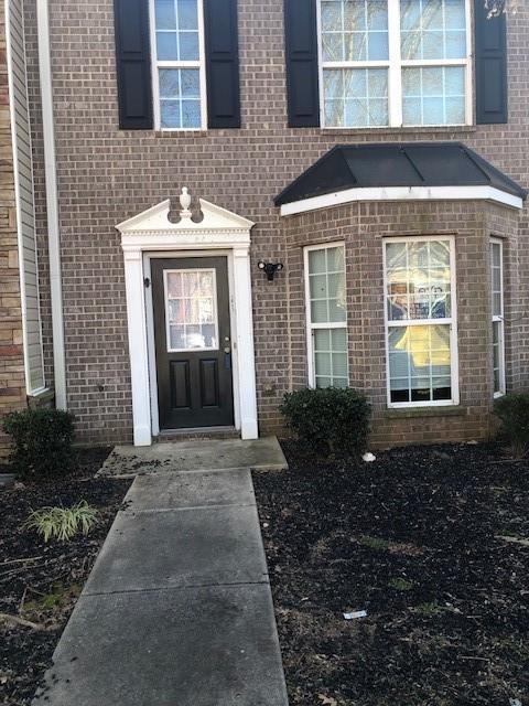 1843 Grove Way Hampton, GA 30228 - Photo 1 of 1 a front view of a house with a yard