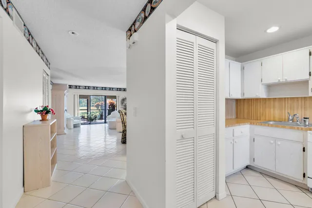 a kitchen with a sink and a refrigerator