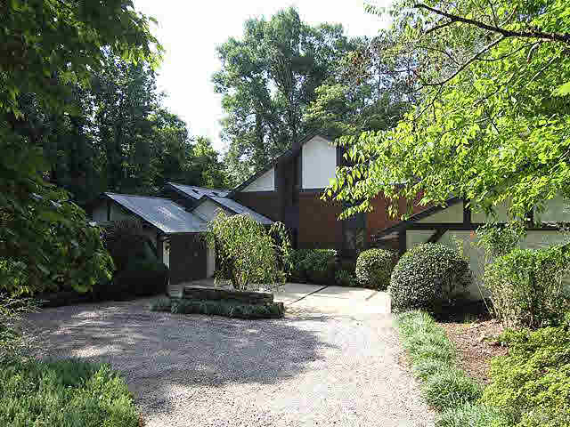 2713 Sherborne Place Raleigh, NC 27612 - Photo 1 of 25 Turning in the first entrance of circular driveway. There are 2 garages, one to the right and one to the left with concrete pads for pulling in and out. Plenty of new gravel has been provided too! Walk to grocery, dining, shops, drug store and more!