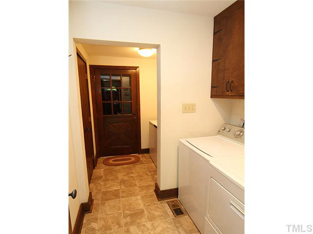 2713 Sherborne Place Raleigh, NC 27612 - Photo 20 of 25 Entrance from left side garage which has a skylight in it too!!! On in through a mud room with pantry and into laundry area. Right where you need it on the main floor near master suite #1. New flooring, fresh paint.