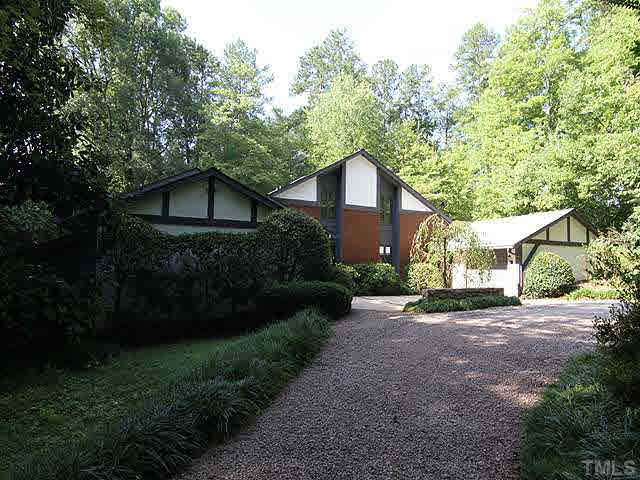 2713 Sherborne Place Raleigh, NC 27612 - Photo 24 of 25 A view from the left entrance of the circular drive as you leave. The driveway also goes straight back to the back yard just to the right of this photo where that shed is located.
