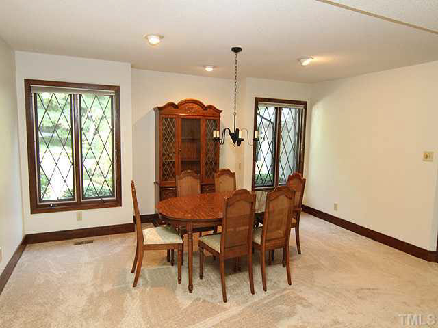 2713 Sherborne Place Raleigh, NC 27612 - Photo 6 of 25 Open to but behind the living area is a large dining room looking out to front of property. Notice fresh paint and new carpet.