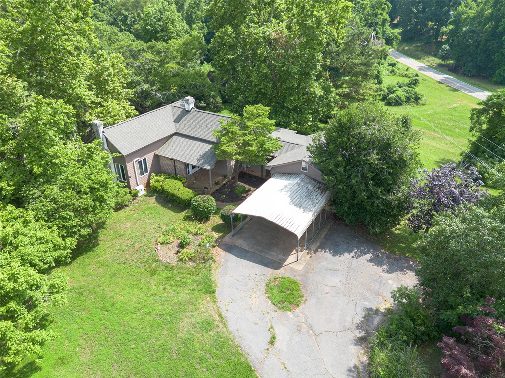 200 Chenault Road Townville, SC 29689 - Photo 44 of 47 A tranquil woodland setting envelopes this charming dwelling with a convenient carport.