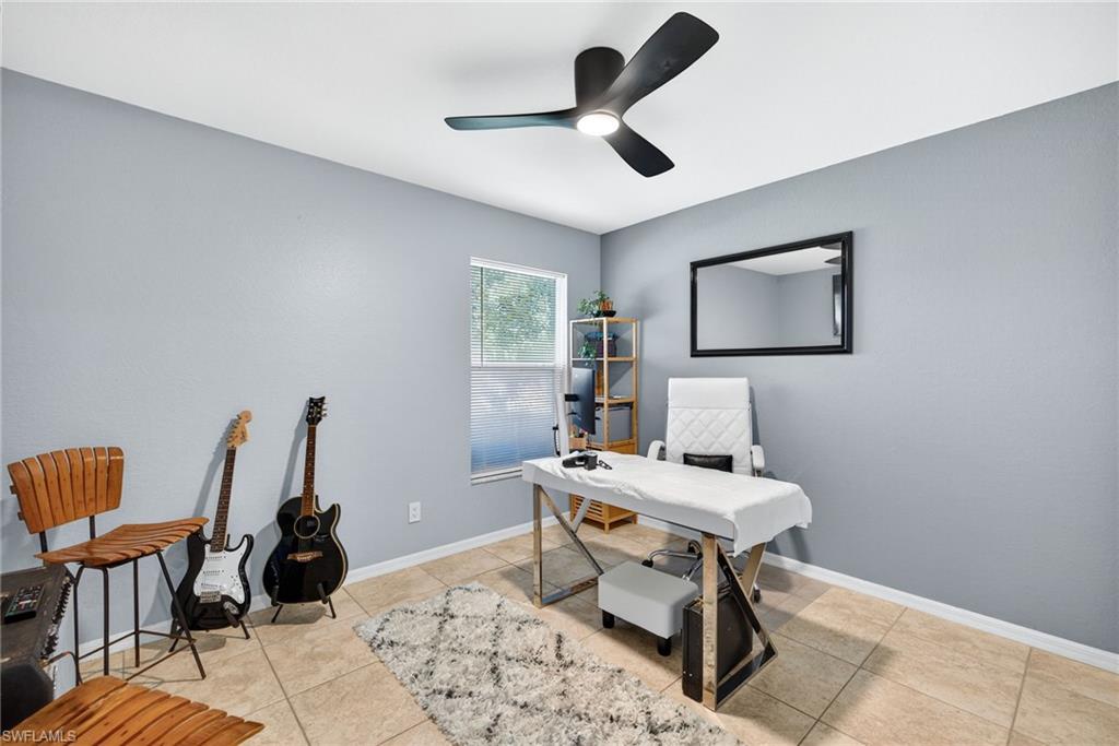 1081 9th Street Southwest Naples, FL 34117 - Photo 23 of 40 Office with light tile patterned floors and a ceiling fan