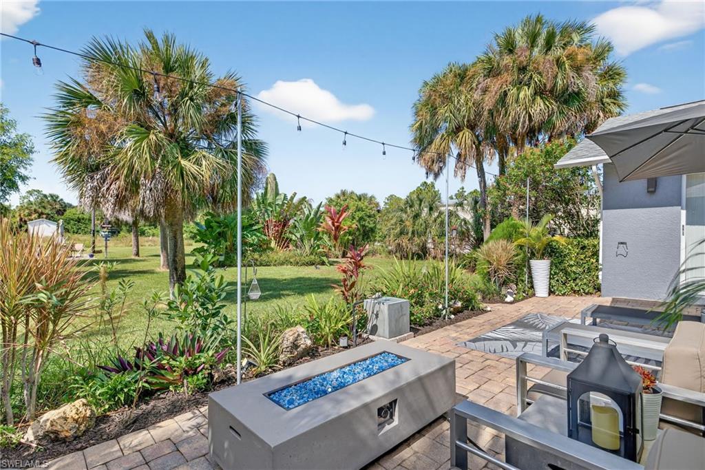 1081 9th Street Southwest Naples, FL 34117 - Photo 28 of 40 View of patio / terrace featuring an outdoor fire pit